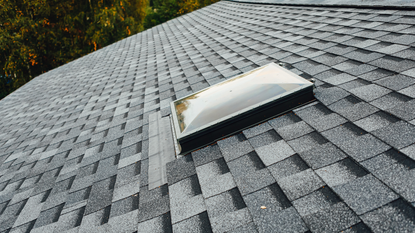 A roof with a skylight on top of it.