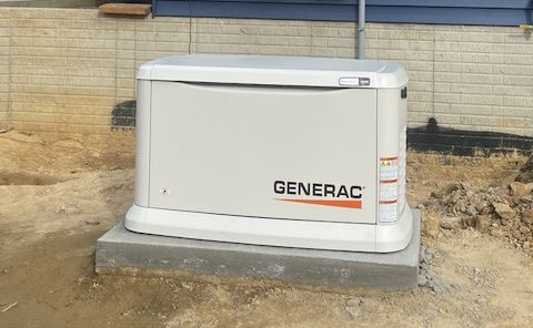 Person starting a yellow portable generator with black wheels inside a building. Person starting a yellow portable generator with black wheels inside a building.