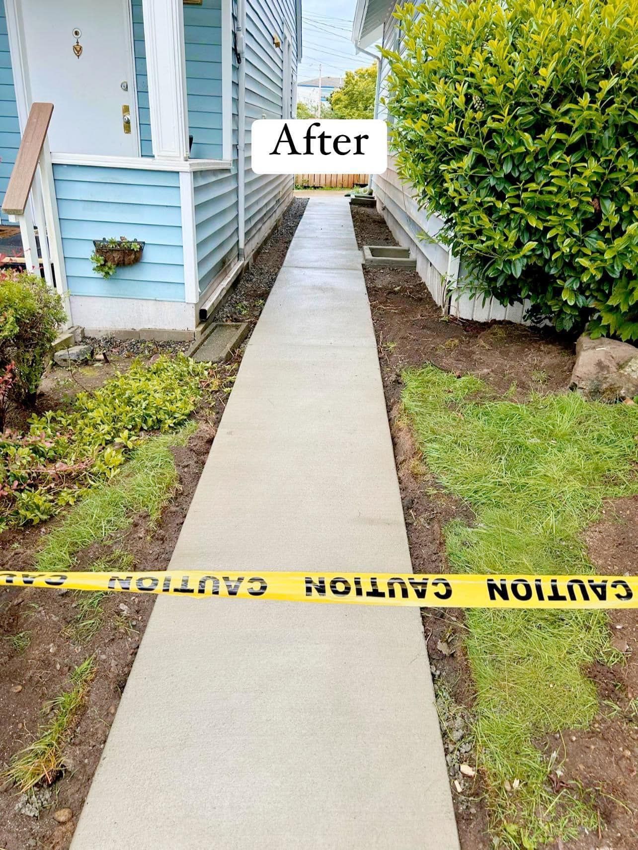 A concrete walkway with stairs leading up to a deck. | Everett, WA | JMS Concrete & Construction LLC