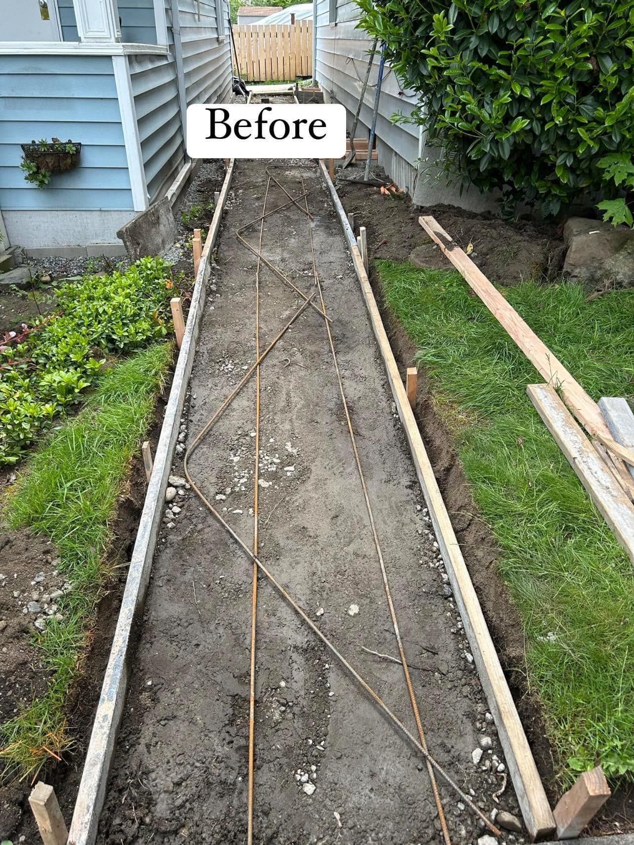 A brick walkway with stairs in the background and a sign that says `` before ''. | Everett, WA | JMS Concrete & Construction LLC