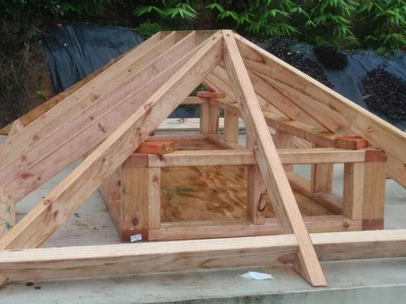 A Wooden Structure Is Being Built On A Concrete Surface — Justmill Carpentry & Building in Smithfield, QLD