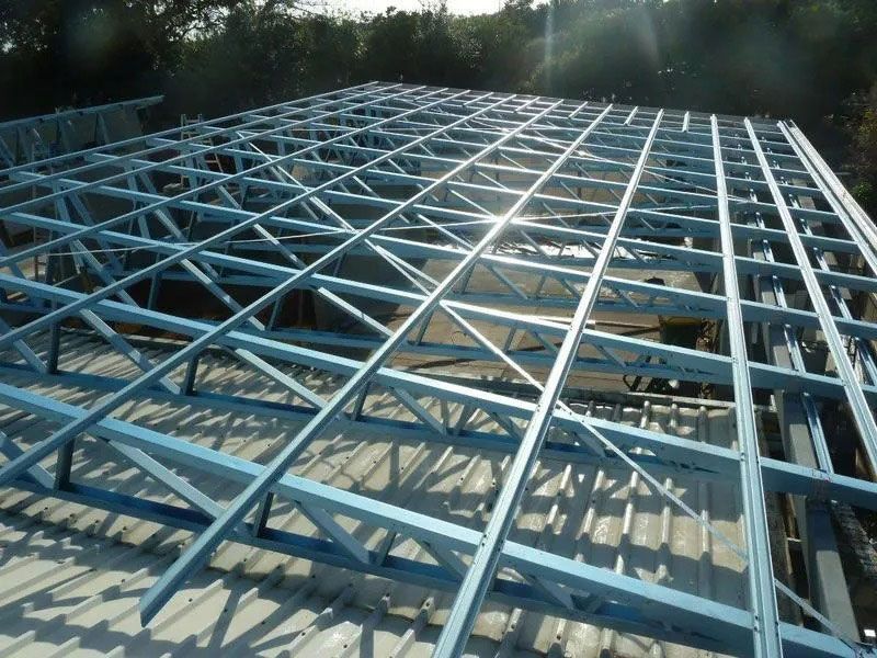 The Sun Is Shining Through The Roof Of A Building Under Construction — Justmill Carpentry & Building in Smithfield, QLD
