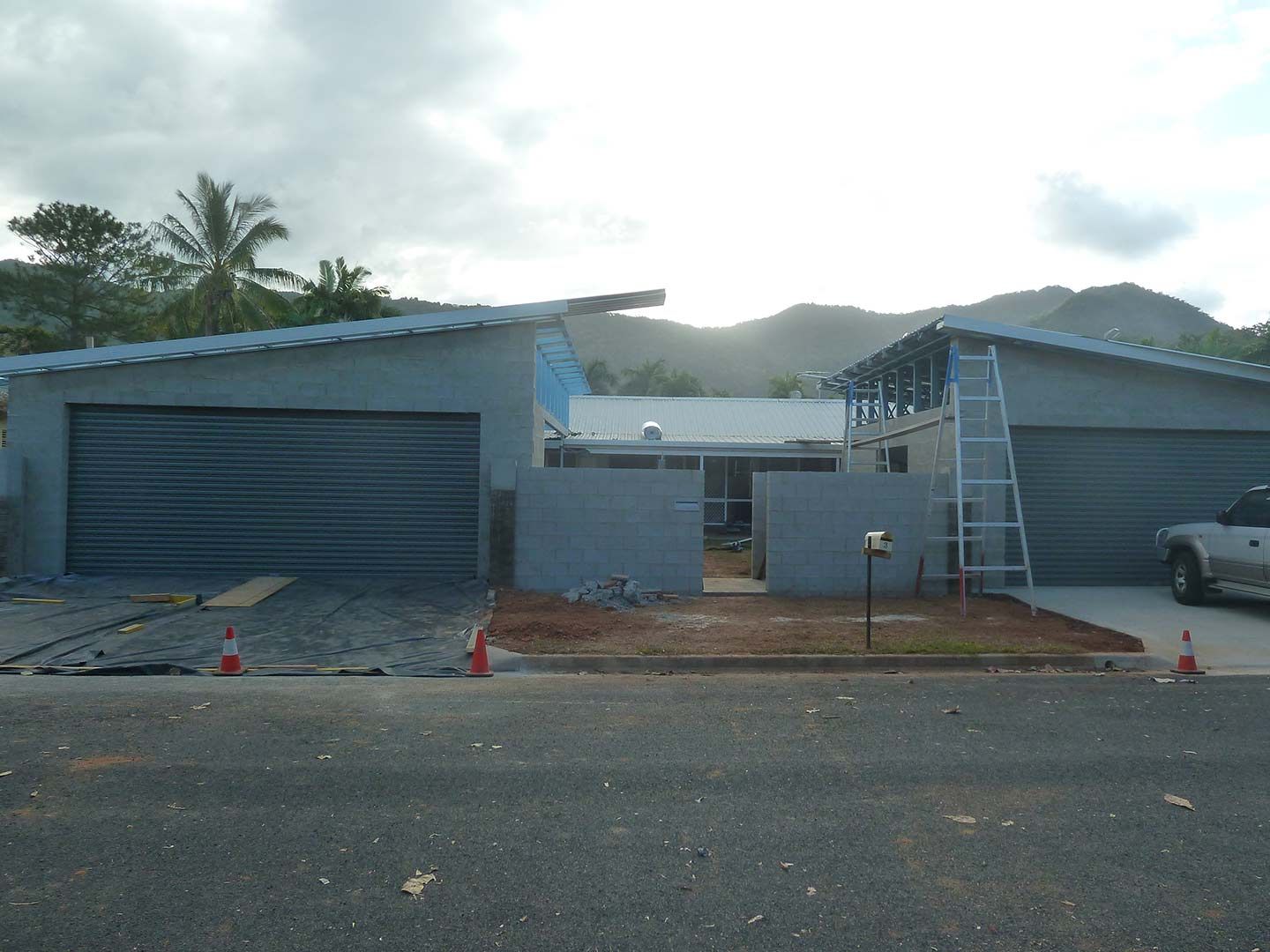 A Truck Is Parked In Front Of A House Under Construction — Justmill Carpentry & Building in Smithfield, QLD