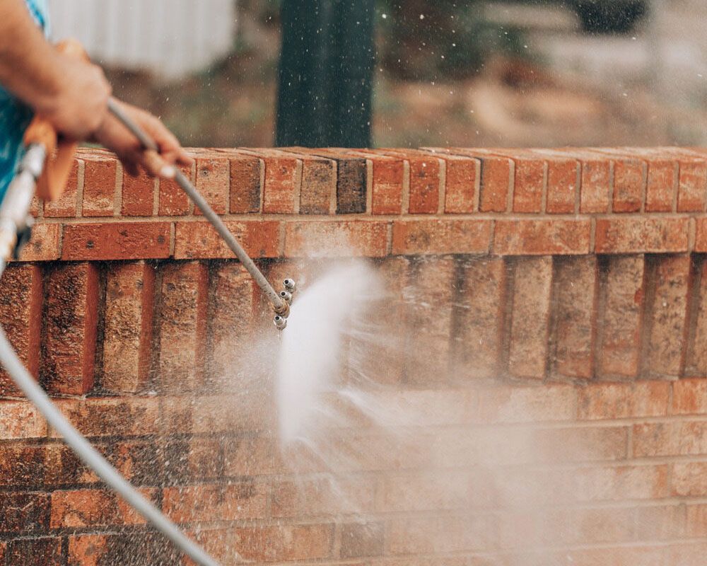 Refreshing the Exterior: Pressure Washing a Brick Fence for a Pristine Clean - Experienced Cleaner in Ballina