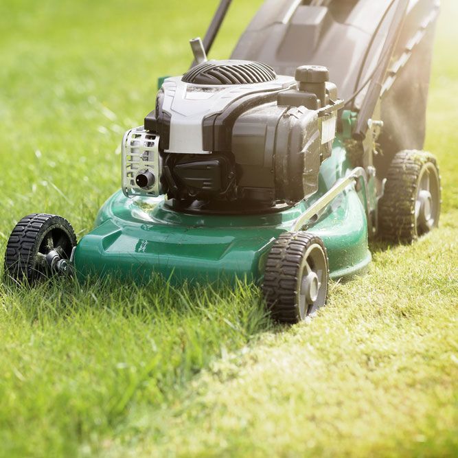 Efficient Lawnmower in Action on the Green Lawn - Comprehensive Cleaning Services in Ballina