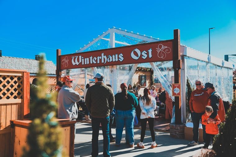 A clear tent with a ferris wheel in the background