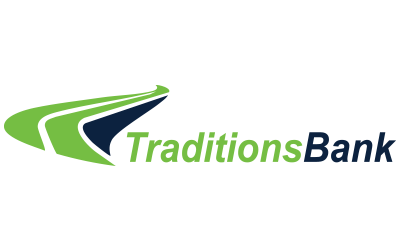 A green and blue logo for traditions bank on a white background.