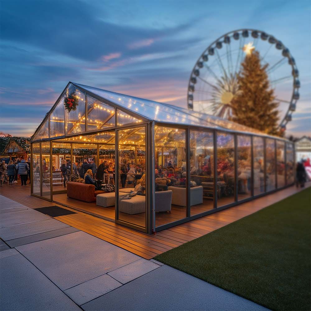 A clear tent with a ferris wheel in the background