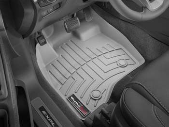 A close up of a car floor mat in a car.