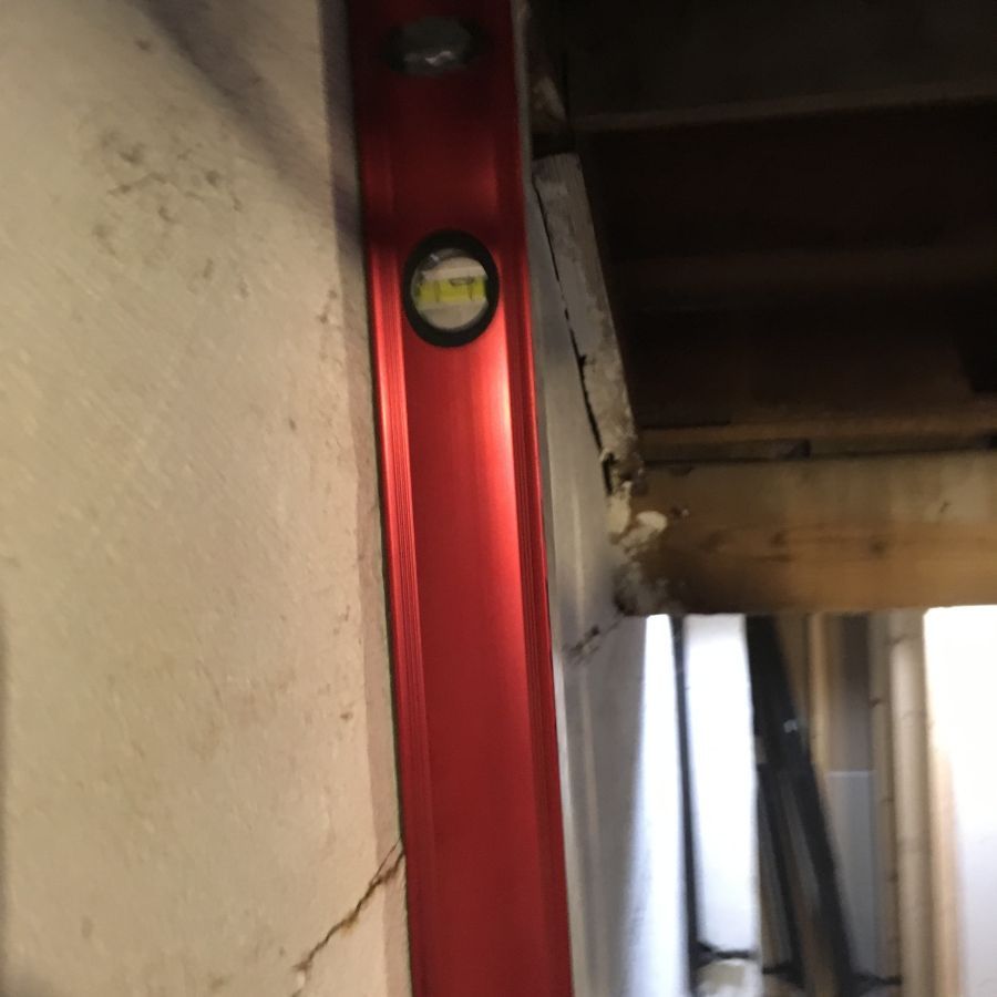 Bowed walls and a leveling tool