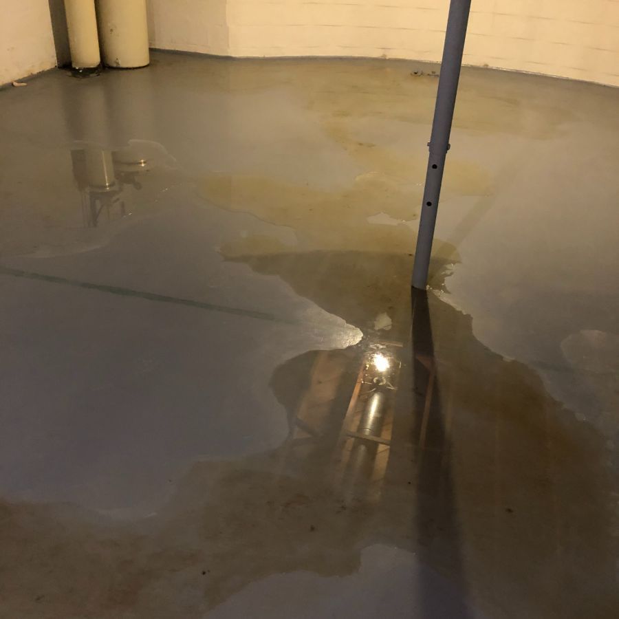 Puddle of water flowing across basement in Erie, PA