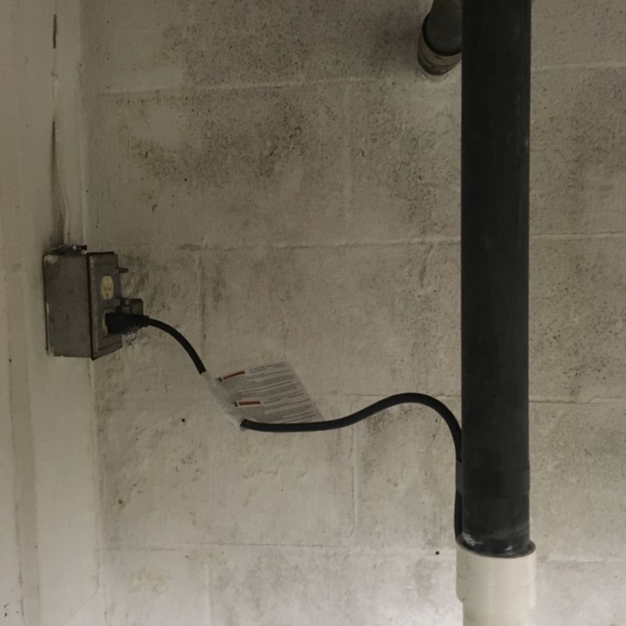 Sump pump installation done to remove water from home