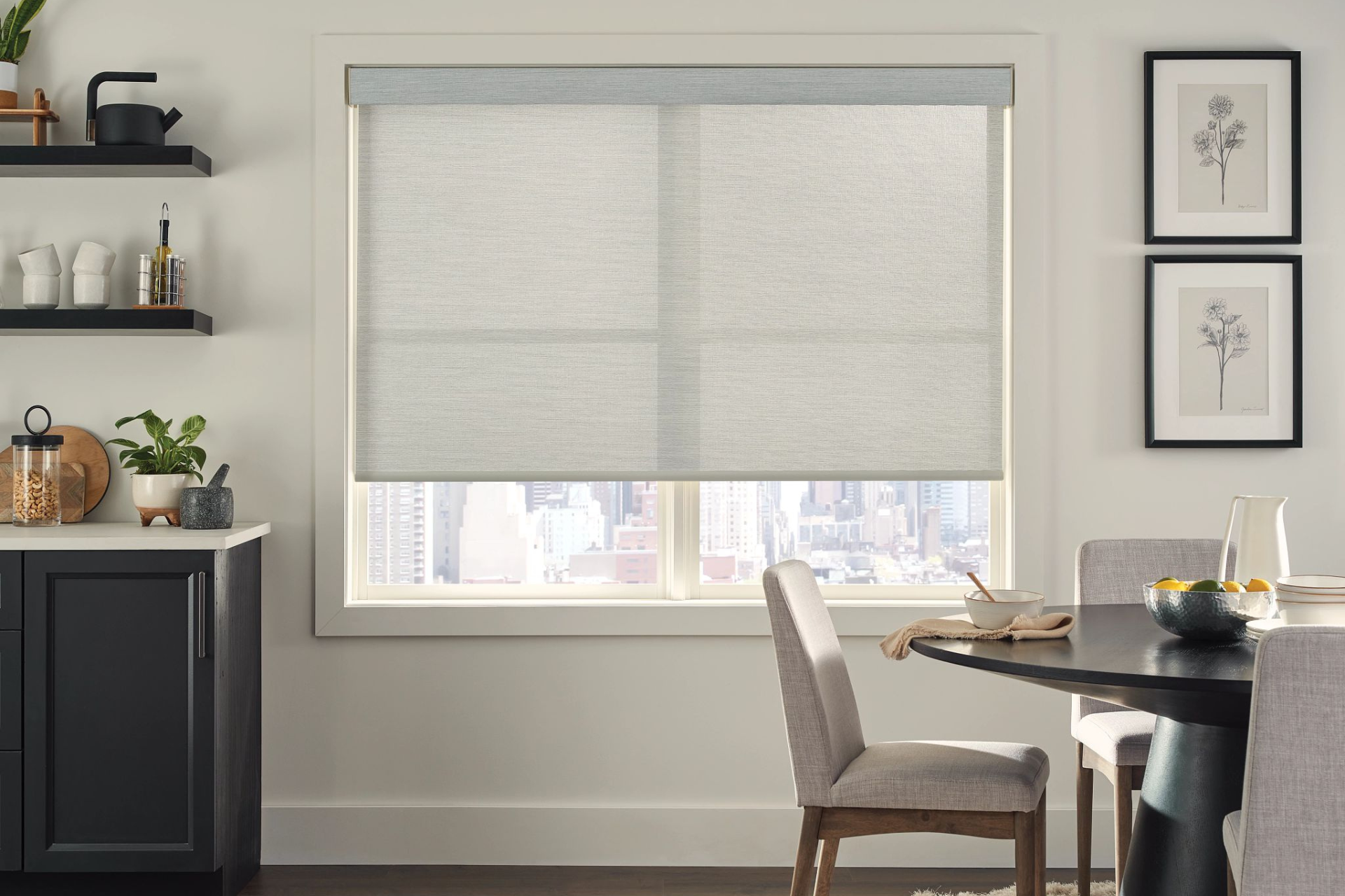 A room with a lot of windows and roman shades