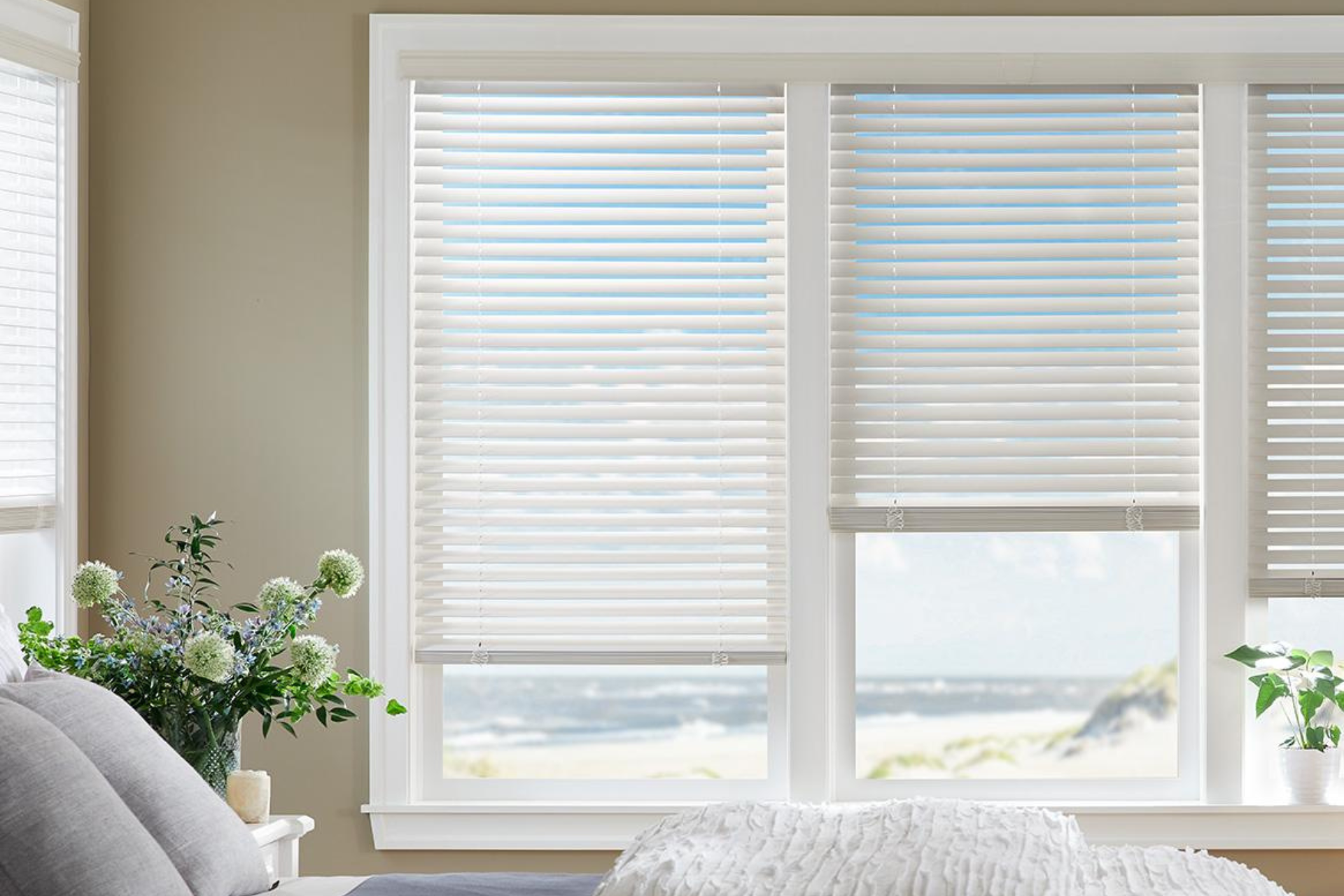 A living room with a couch , chair , coffee table and fireplace.