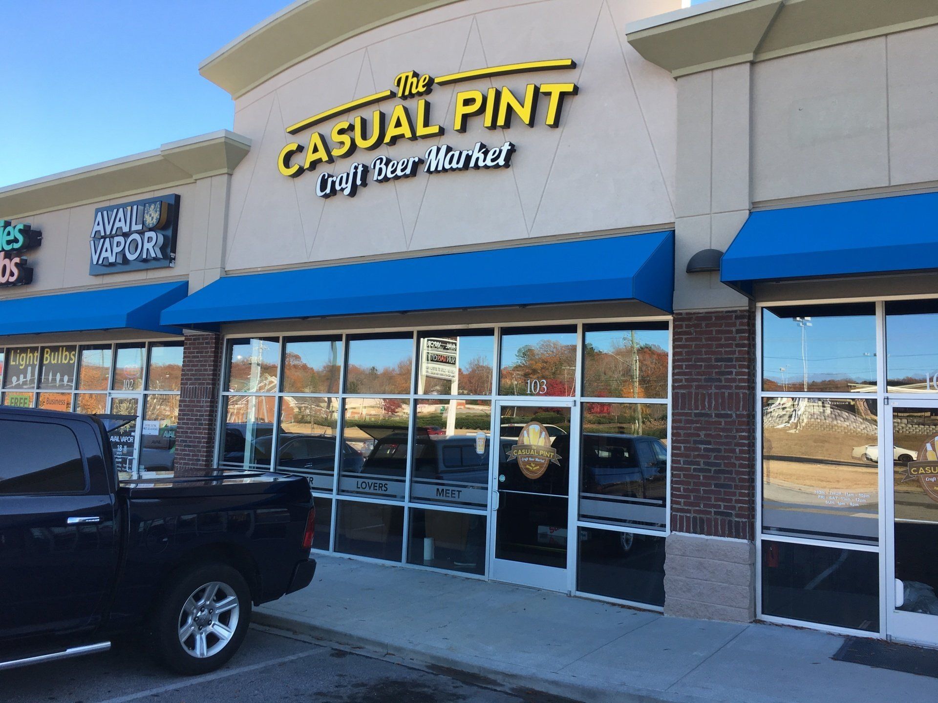 A truck is parked in front of the casual pint