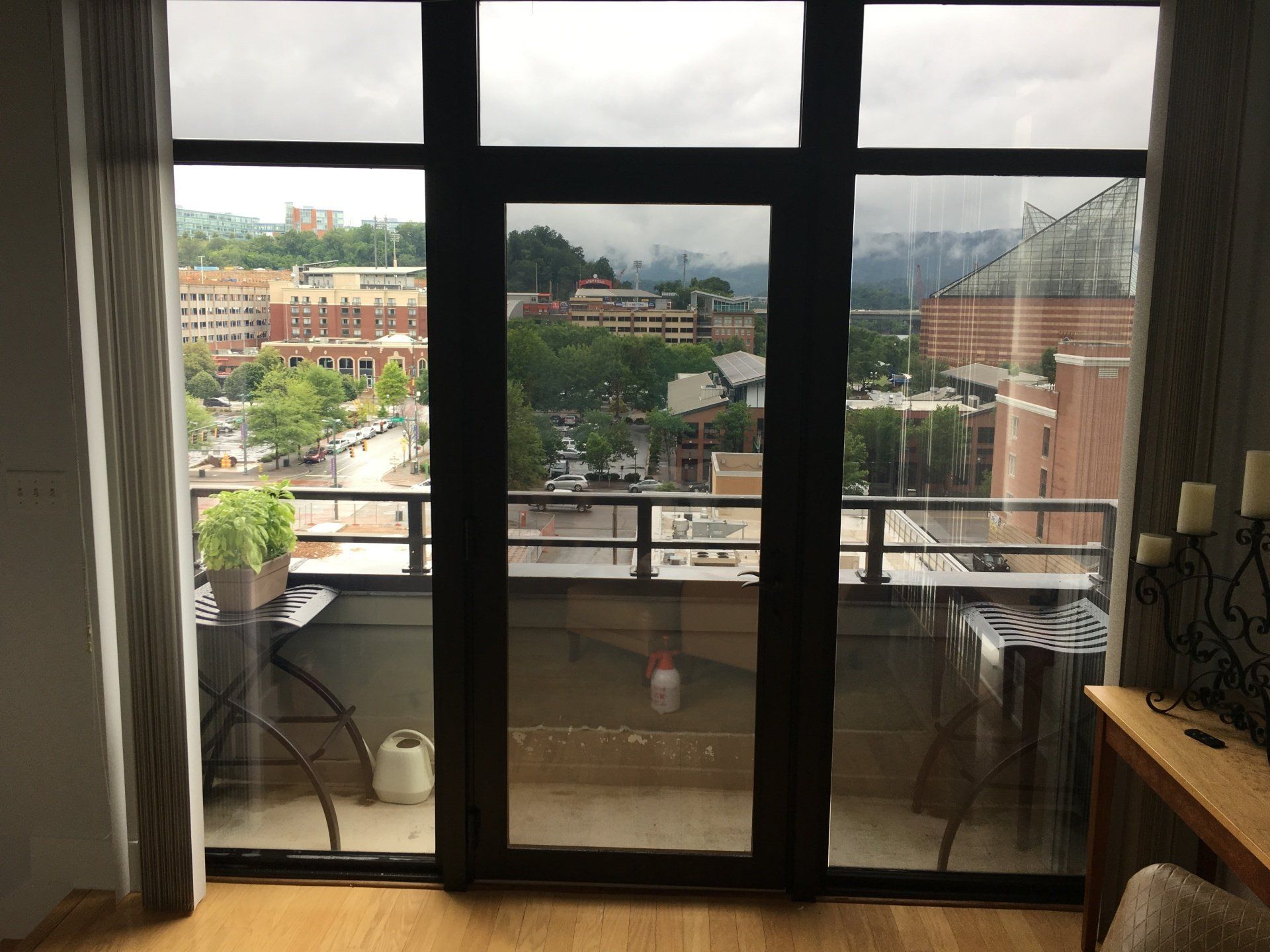 A large window with a view of a city and mountains