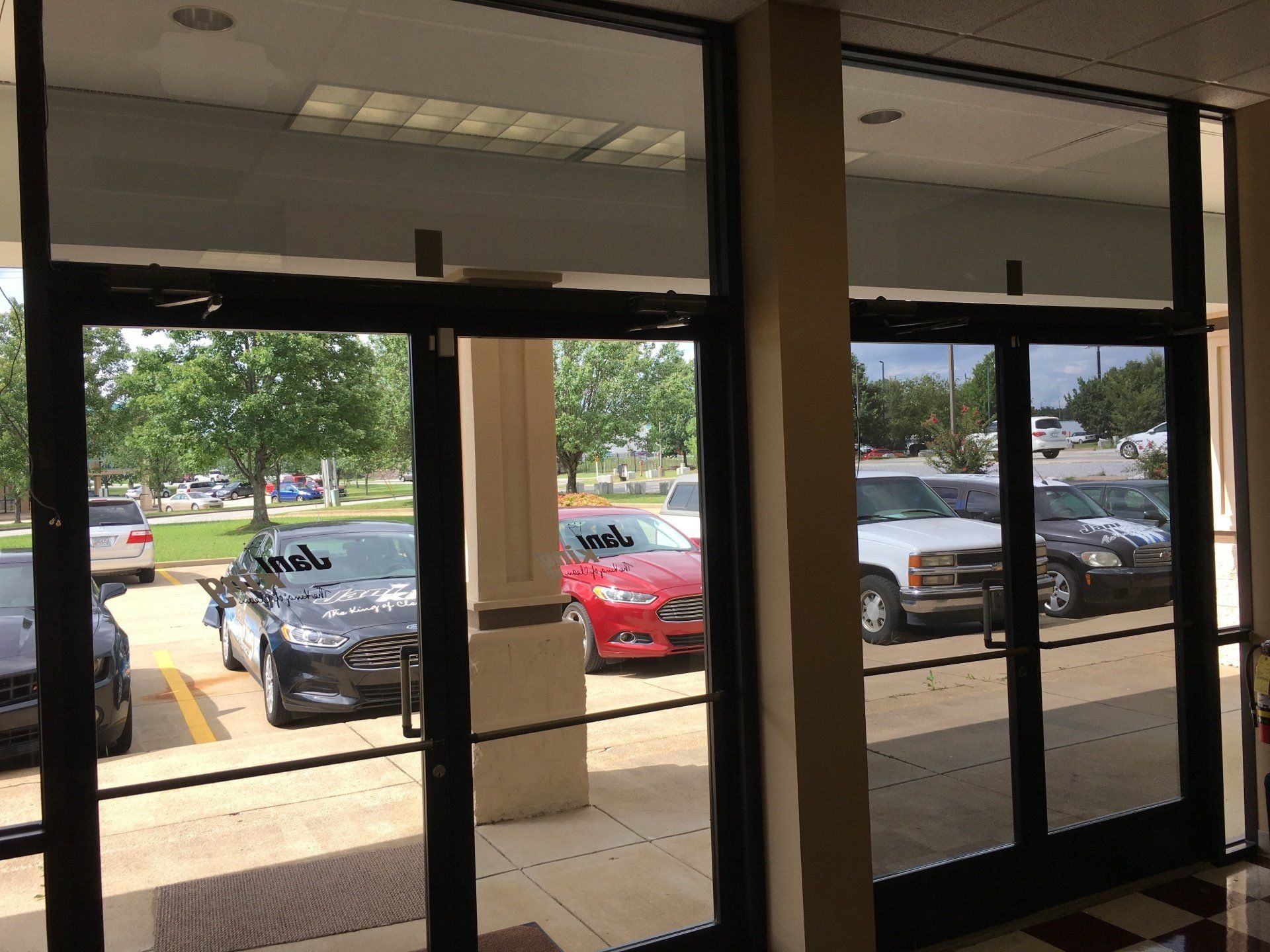 A building with a lot of cars parked in front of it