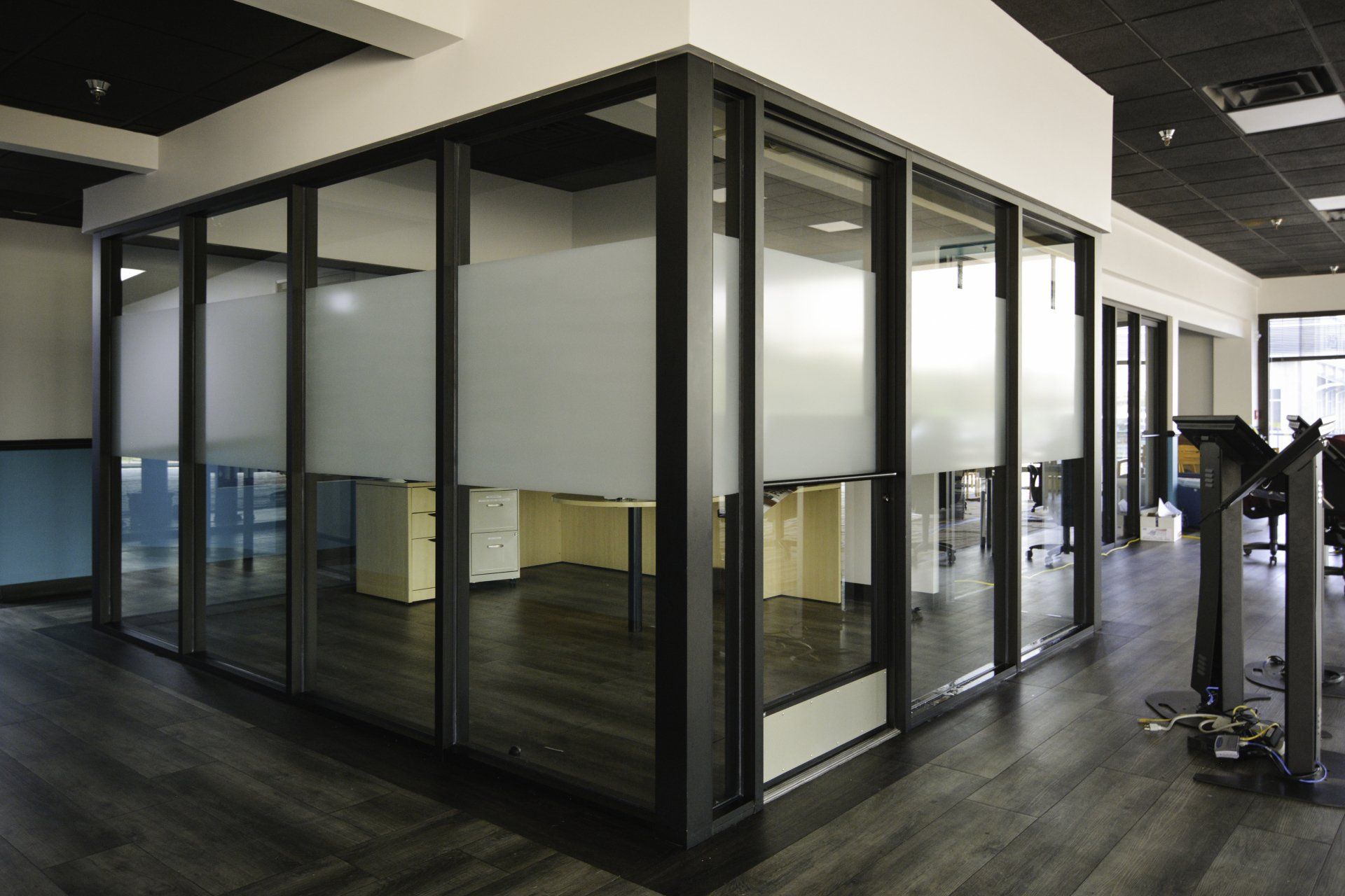 A large room with a lot of windows and tables