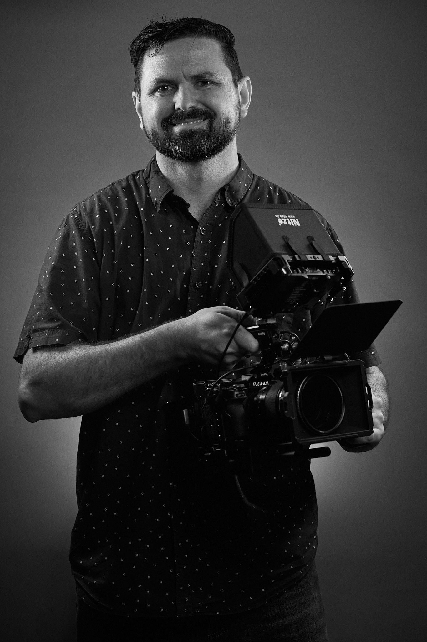 Owner holding a camera.