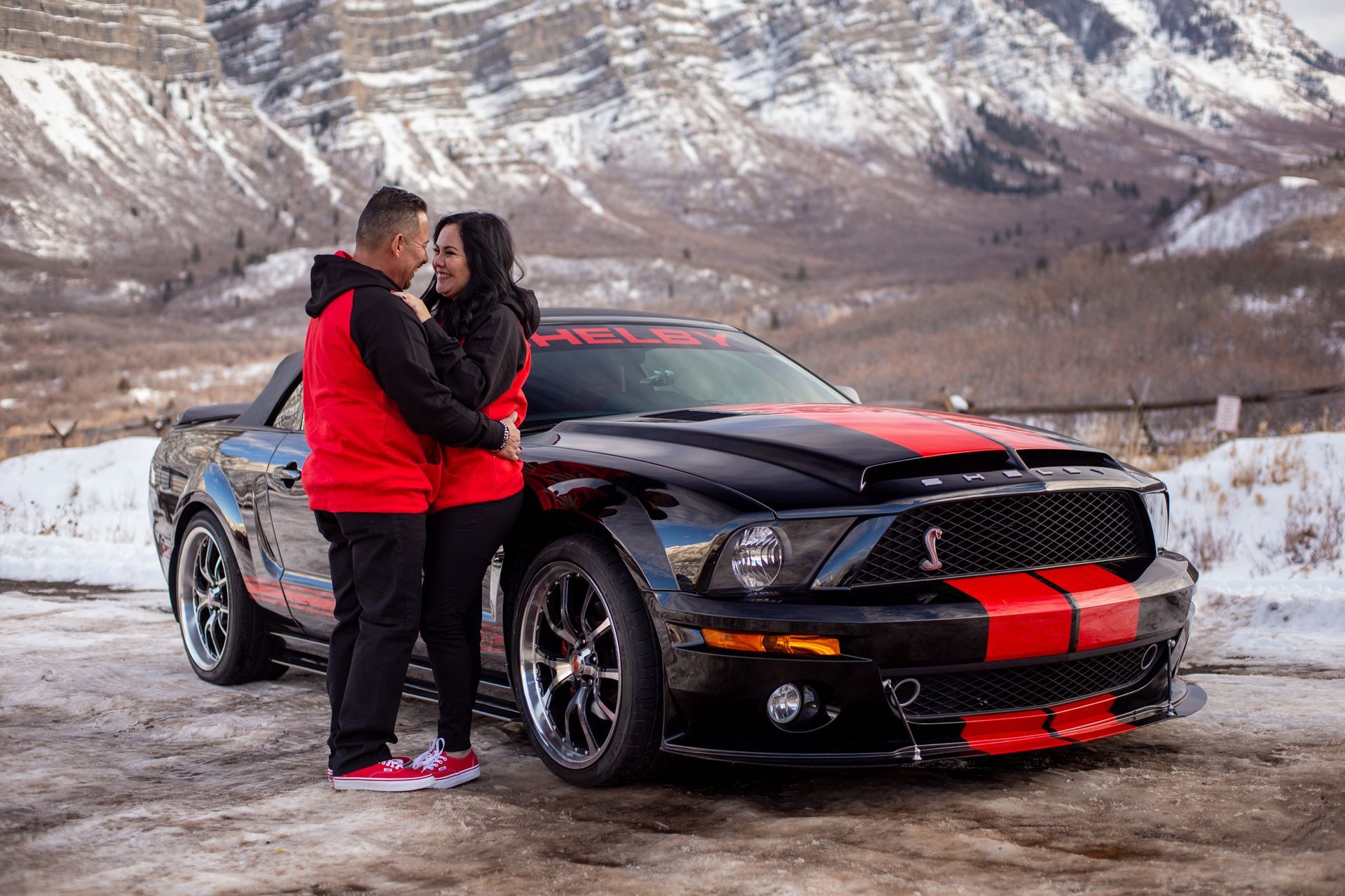 Close-up of a person holding a digital camera.