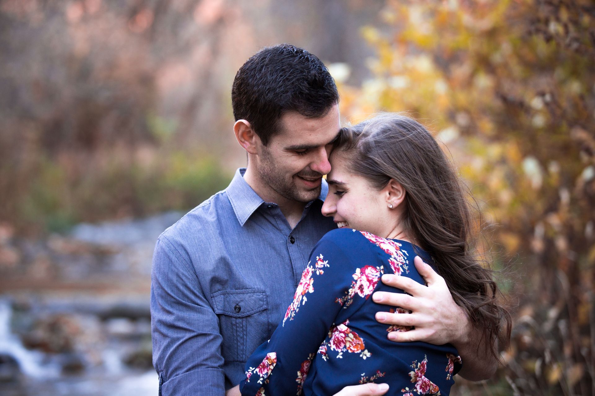 A stack of light purple boxes with a glittery star pattern and a circular sticker on the top box.