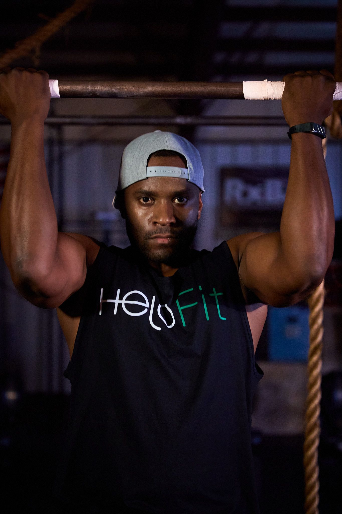 A person wearing a grey cap and black 