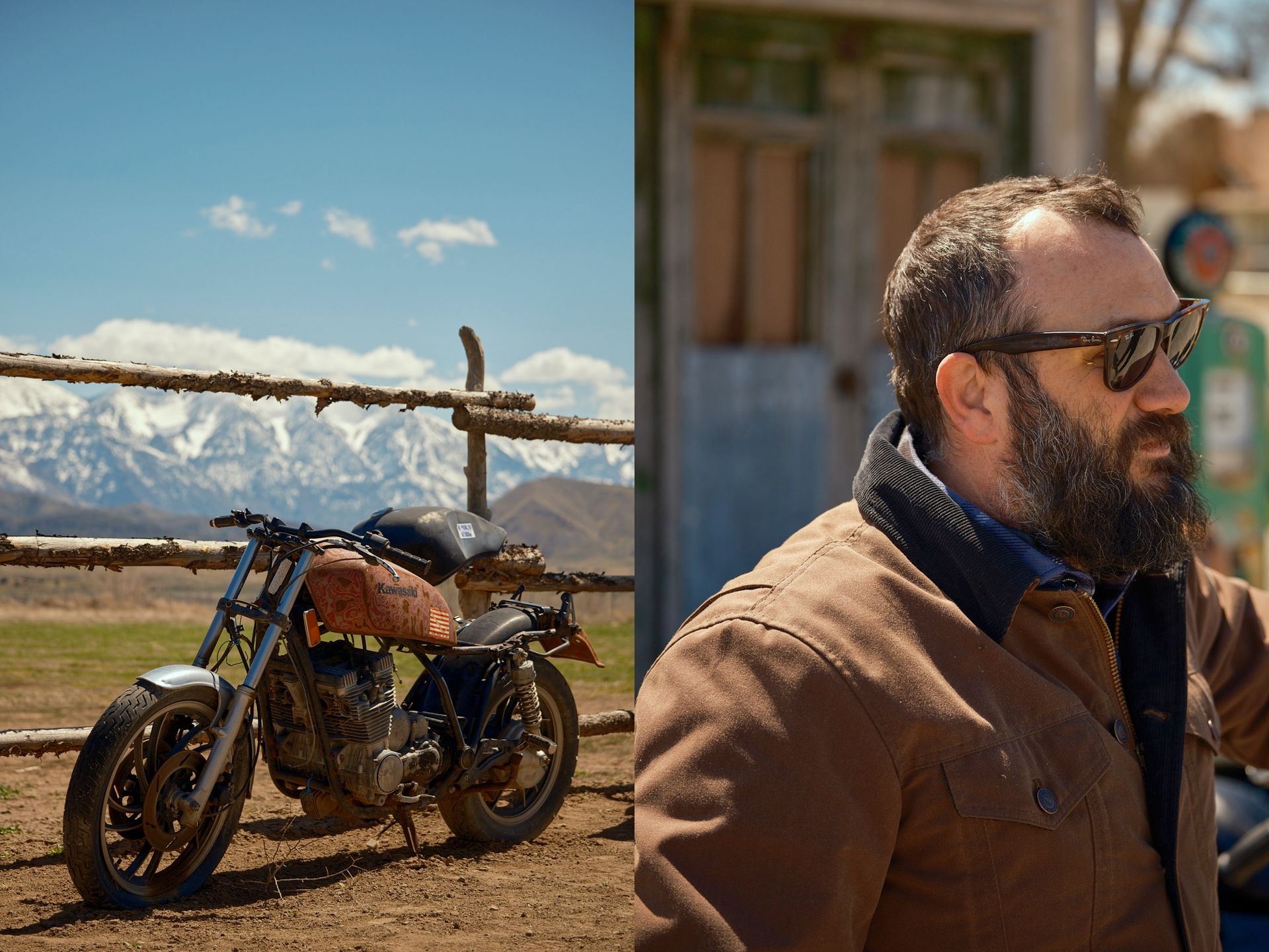 A man with a beard and sunglasses stands near a rustic motorcycle.