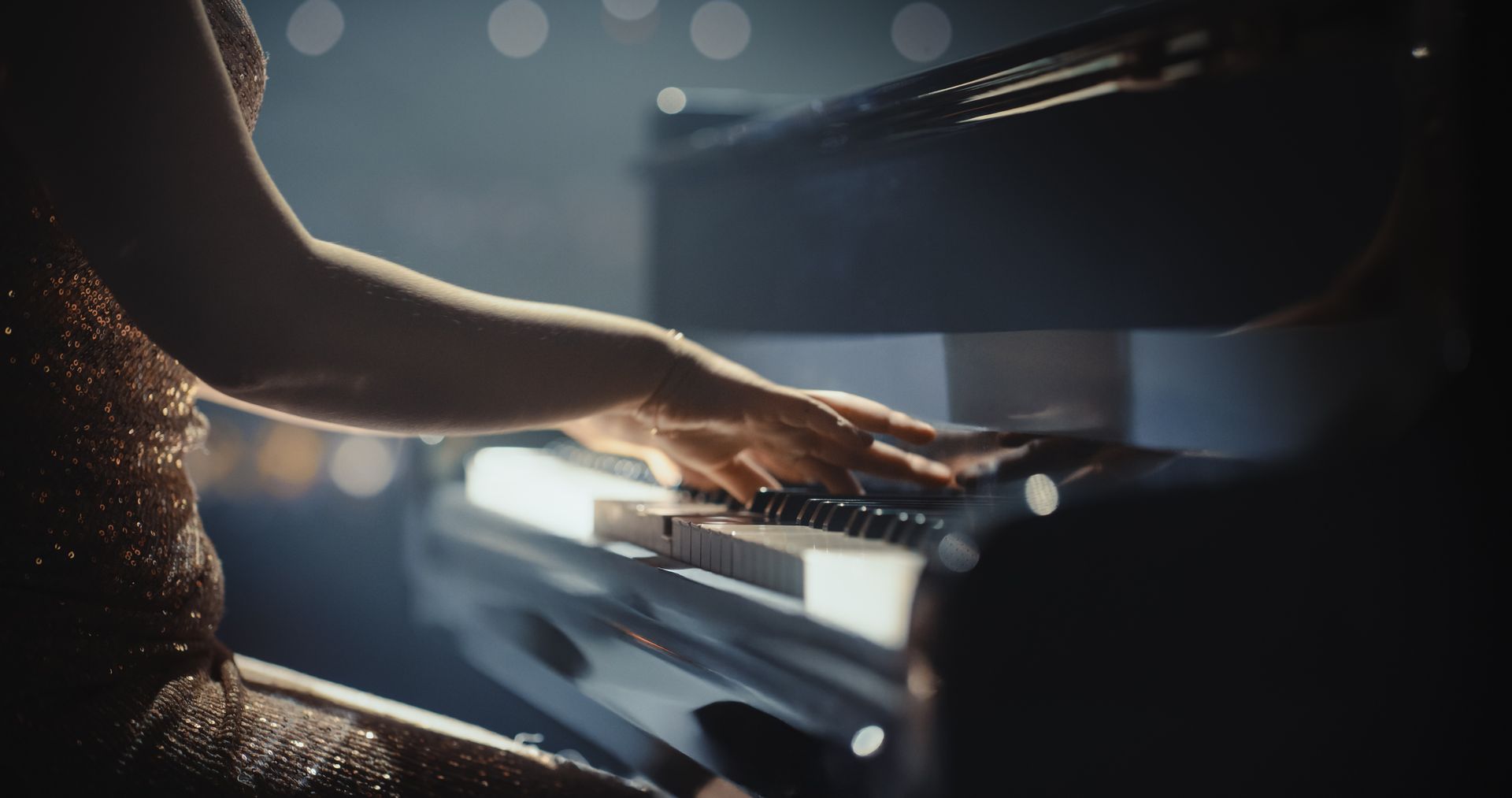 Person's hands playing piano.