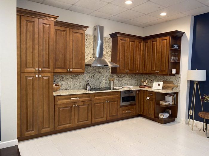 A kitchen with wooden cabinets and stainless steel appliances.
