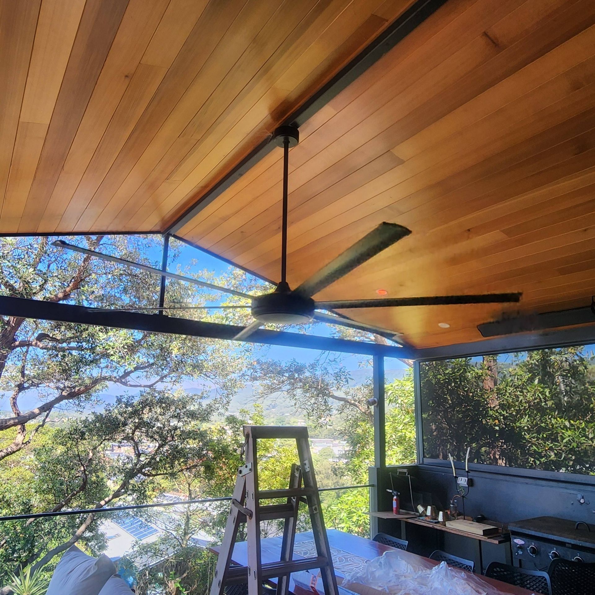 Ceiling Fan Installed On Wooden Patio With Mountains