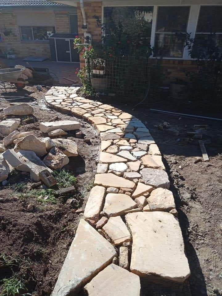 A Stone Walkway is Being Built in Front of a House — Queanbeyan East, NSW — Traditional Stone Structures