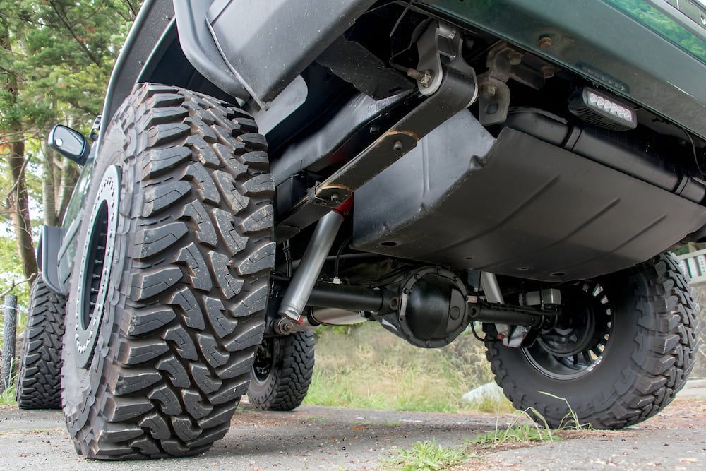 The Underside Of A Truck With A Large Tyre — Josh's Diesel Services in Boyne Island, QLD