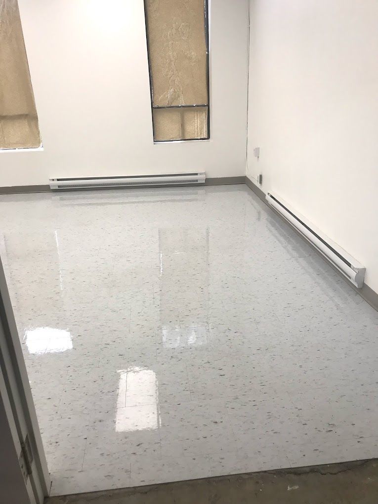 A room with a white floor and white walls.