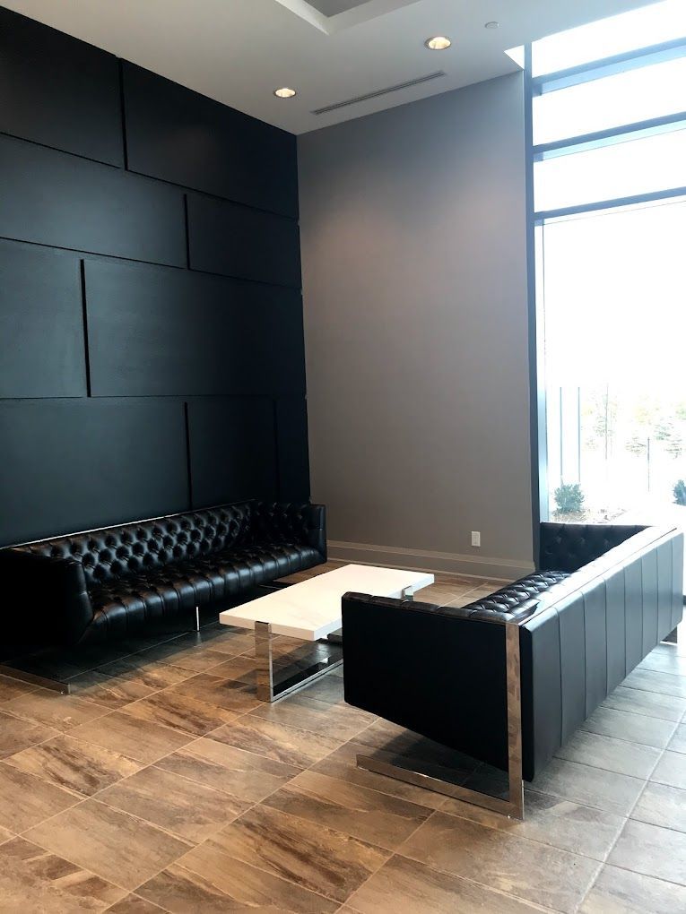 A living room with two couches and a coffee table.