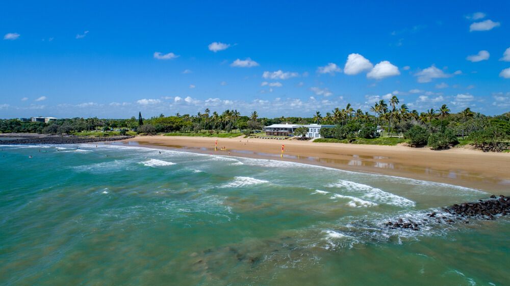 An Aerial View of A Beach with A House in The Distance — BTV Antenna & Data in Burnett Heads, QLD