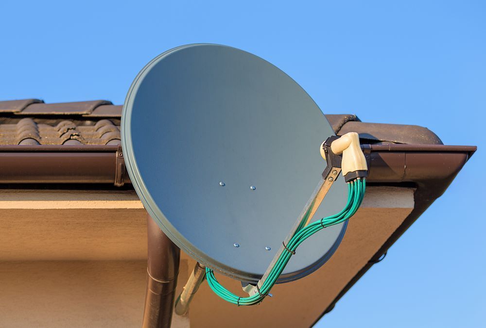 A Satellite Dish Mounted on a Brown Roof — BTV Antenna & Data in South Kolan, QLD
