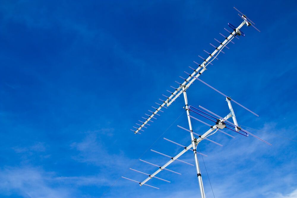 A Large Antenna Against a Blue Sky with Clouds — BTV Antenna & Data in Moore Park, QLD