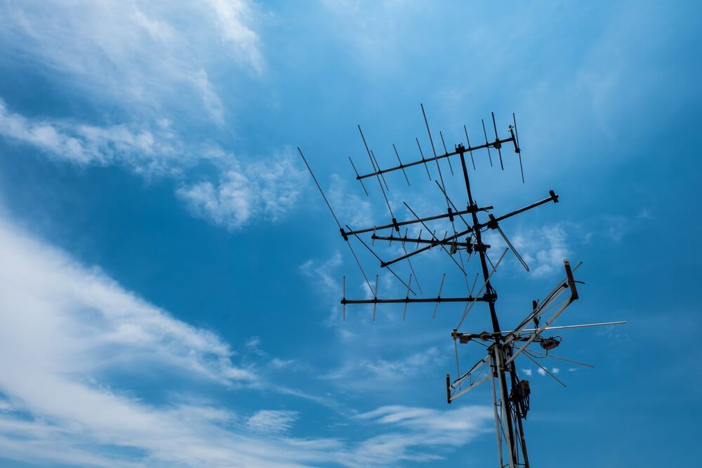 A Very Tall Antenna Against a Blue Sky with Clouds — BTV Antenna & Data in Coral Cove, QLD
