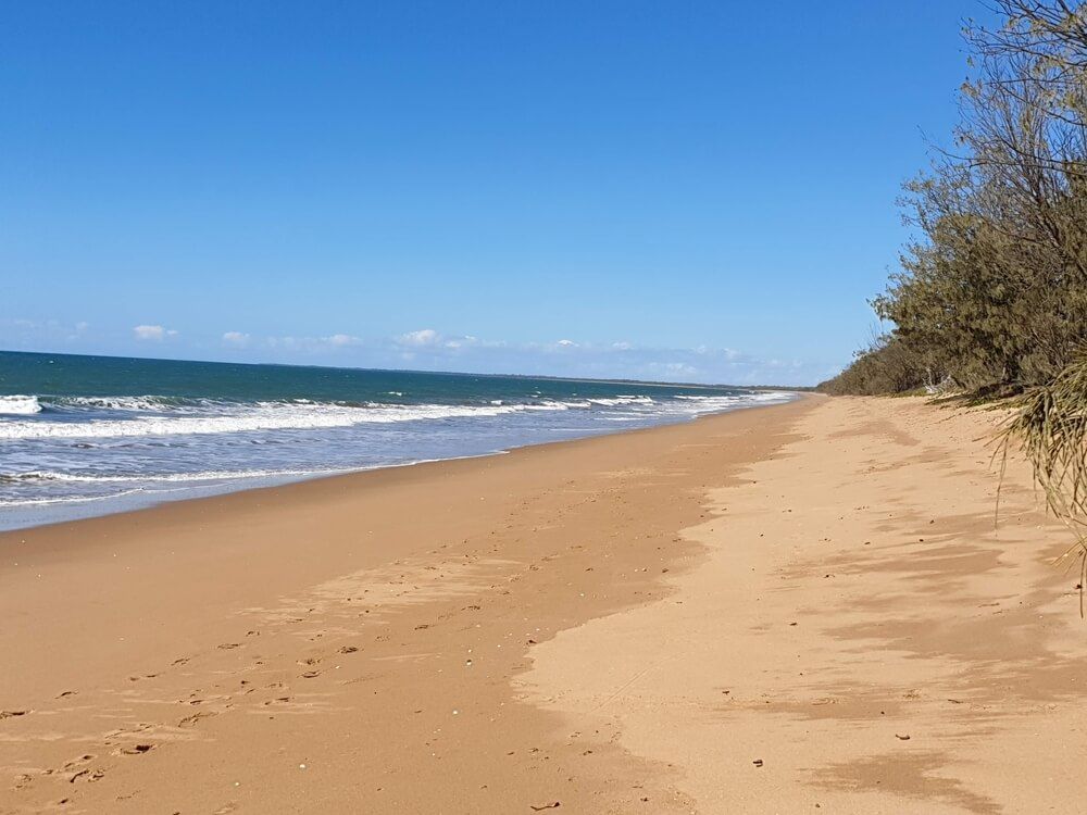 A Sandy Beach with A Blue Sky and Waves Coming In — BTV Antenna & Data in Moore Park, QLD