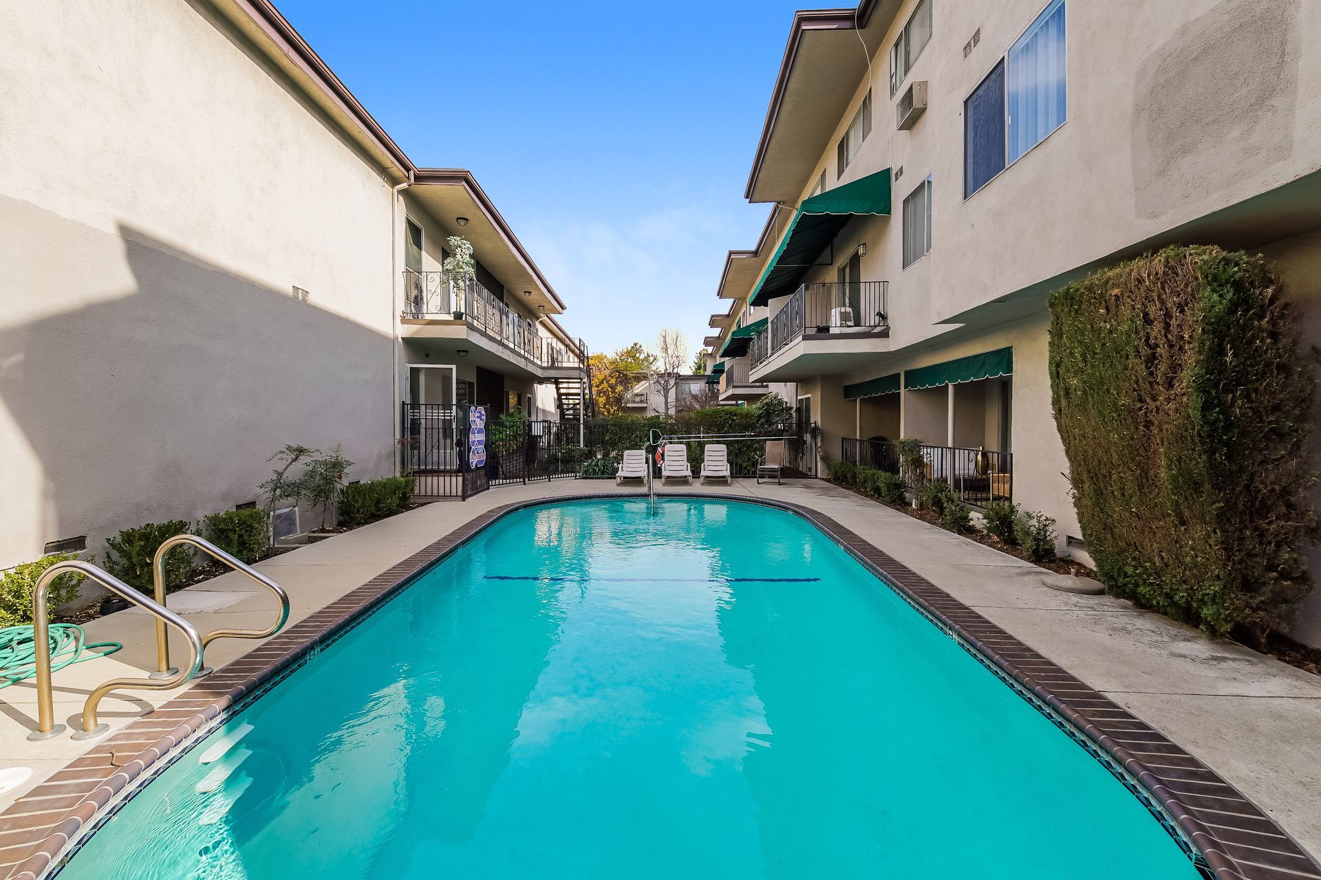 A large swimming pool in the middle of a building.
