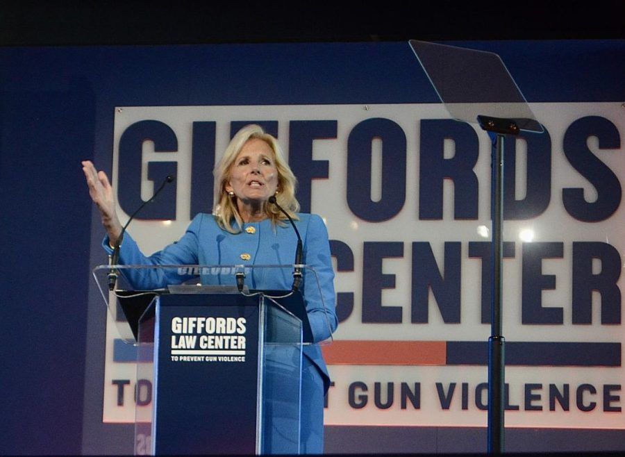 Jill Biden presenting at a podium in front of a sign that says giffords center