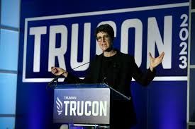 Rachel Maddow at podium during the Trucon 2023 event .