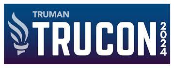 a blue and purple logo for truman trucon .