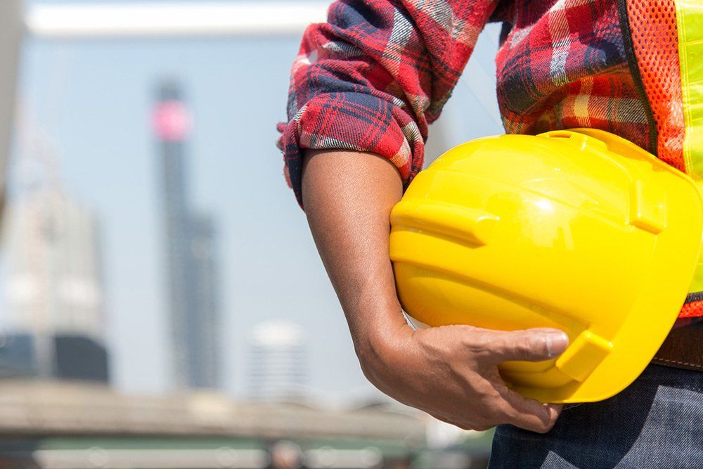Distribution Careers — Worker Holding Yellow Helmet in Miami, FL