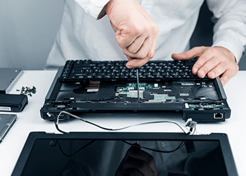 Man repairing laptop - Computer repair in Venice, FL