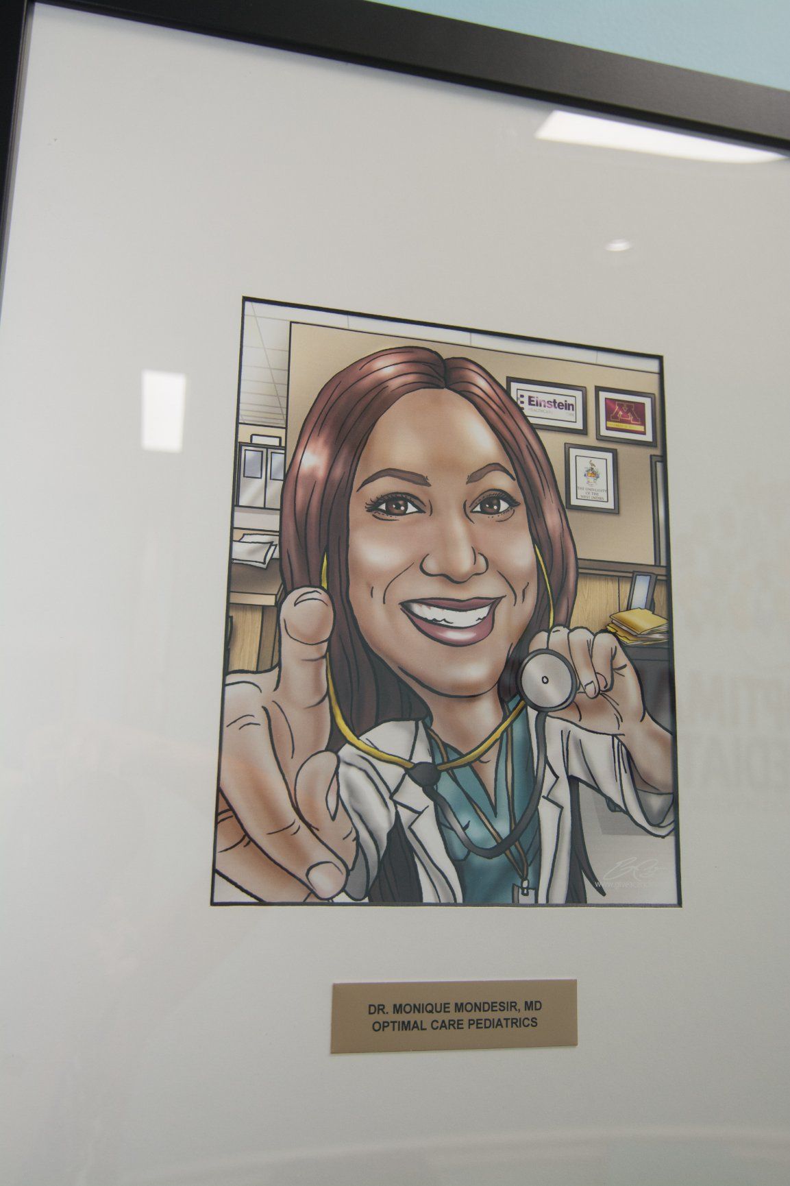 Cartoonized photo of Dr Monique Vondesir, MD smilling, holding up her stethoscope pointing