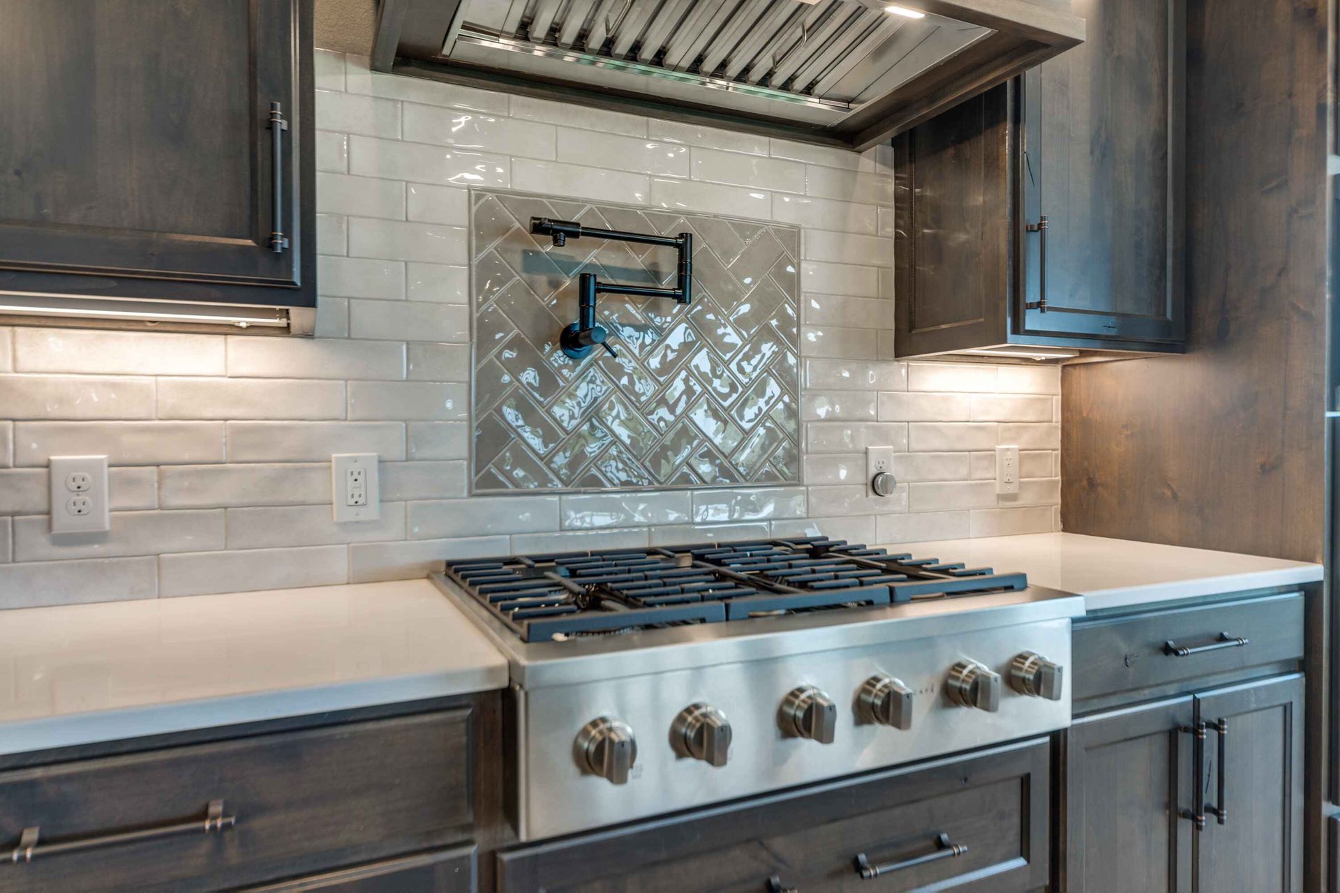 A stove top oven is sitting on top of a counter in a kitchen.