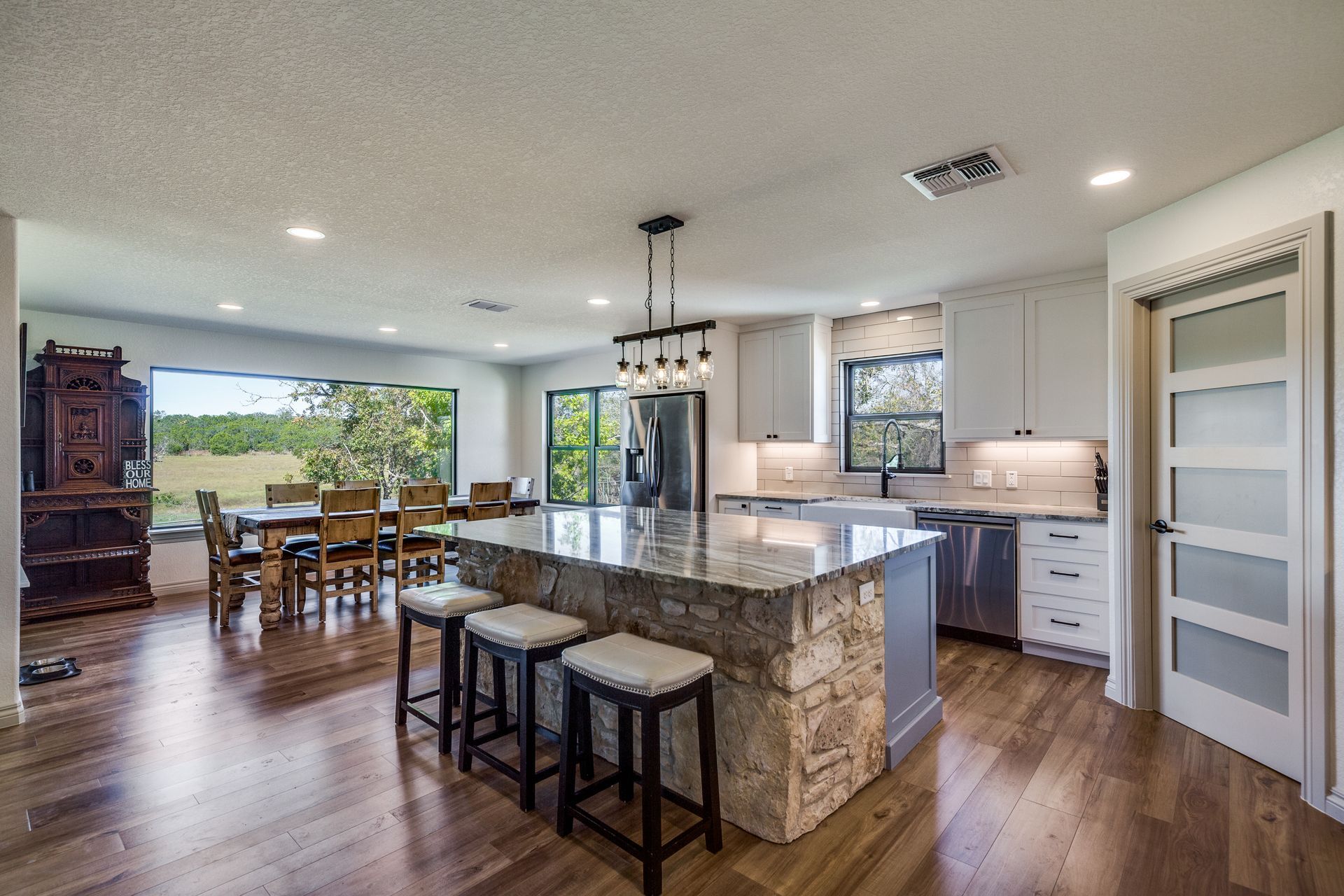 There is a large island in the middle of the kitchen.