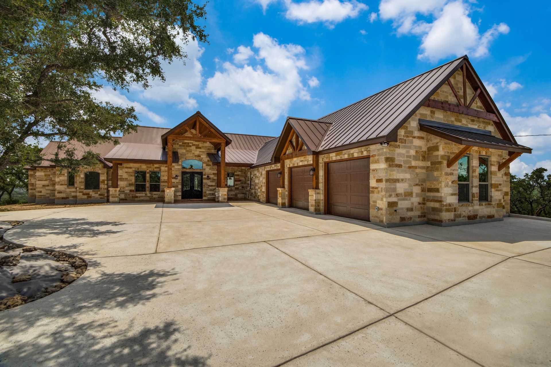A large brick house with a copper roof is for sale.