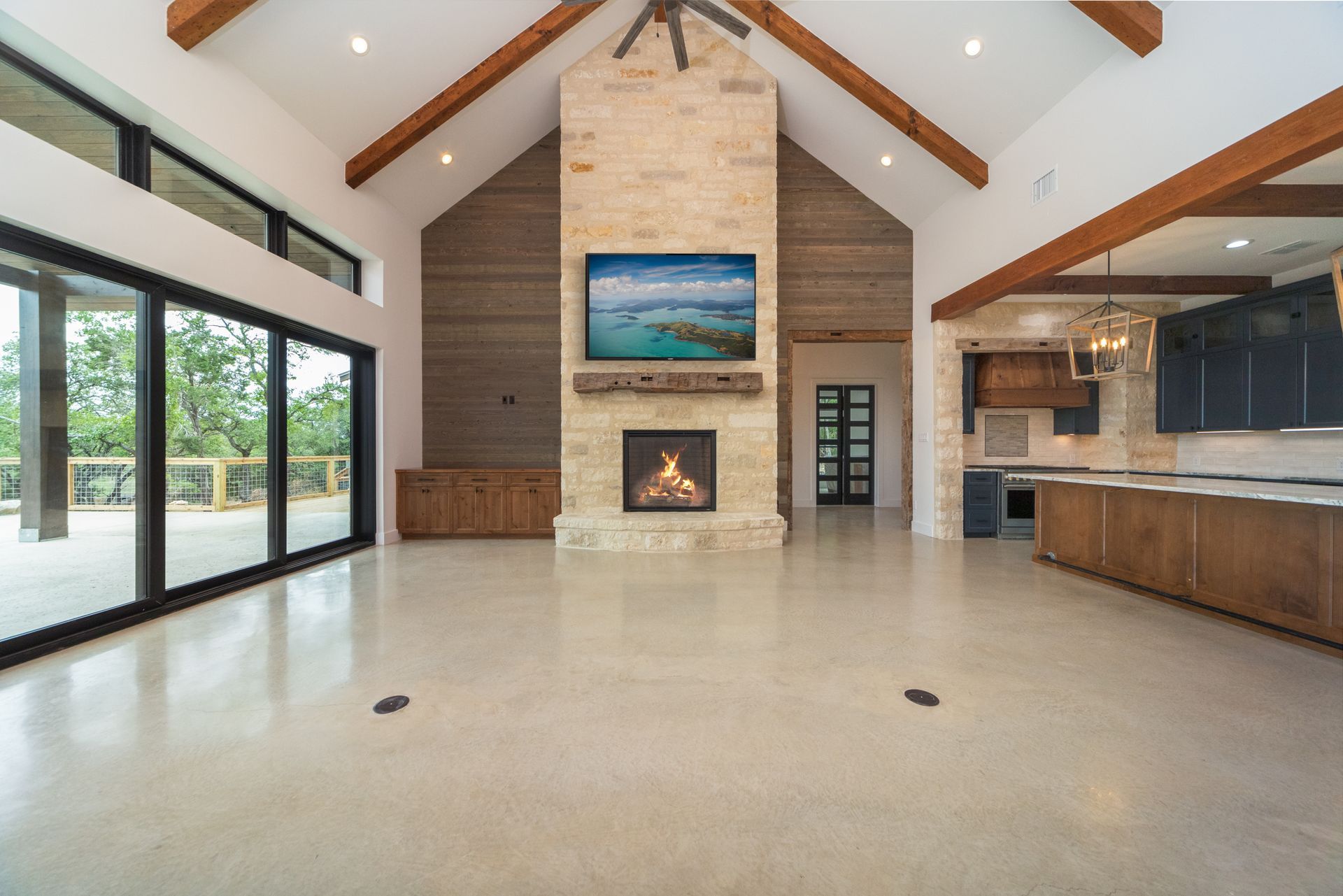 A living room with a fireplace and a flat screen tv.